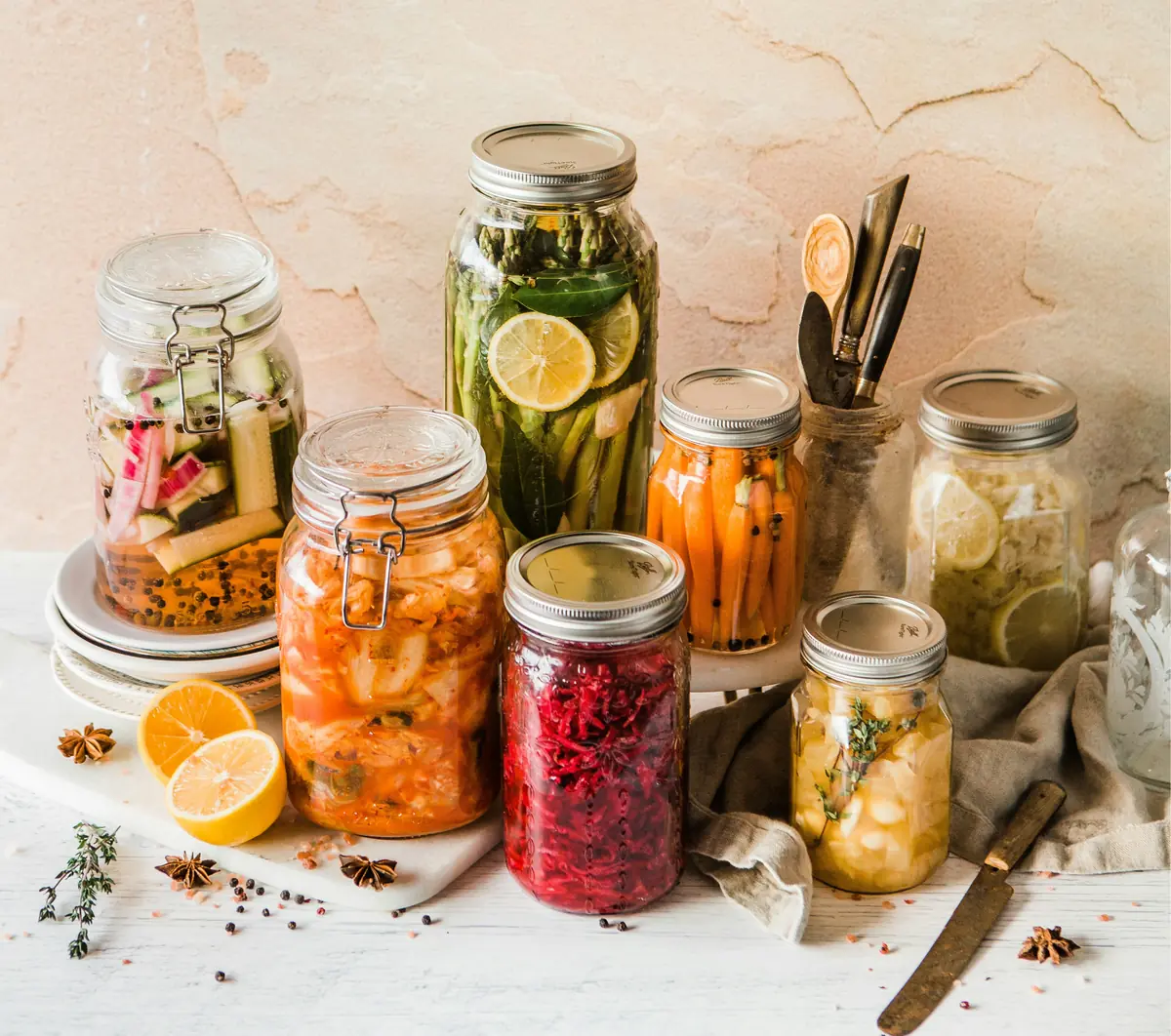 Jars of diverse fermented foods including kimchi, sauerkraut and pickled vegetables that support gut microbiome diversity
